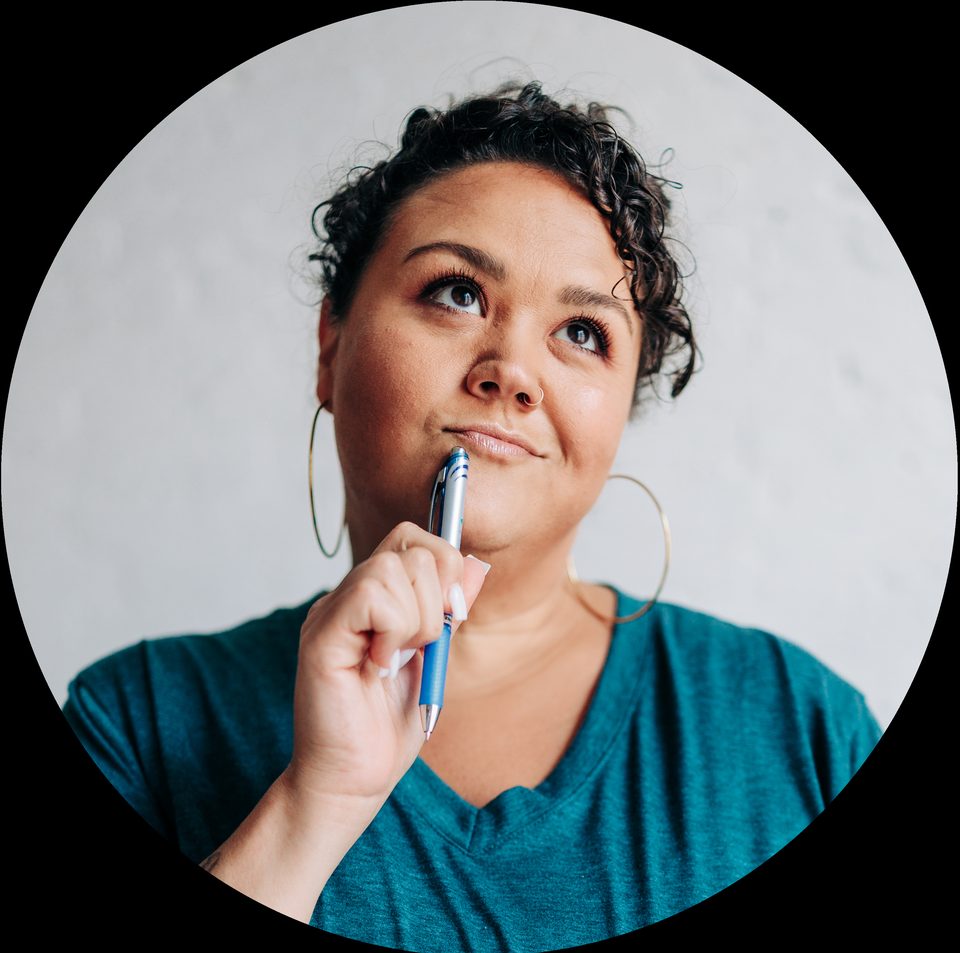 Alea Manning, thoughtful expression in a circle-cropped portrait